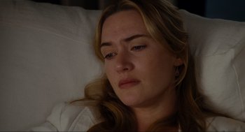 Movie still from “The Holiday” (2006), directed by Nancy Meyers – A person laying in a bed; Close Up shot, High angle