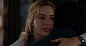 Movie still from “The Holiday” (2006), directed by Nancy Meyers – A person hugging a person; Close Up shot, Over the shoulder angle