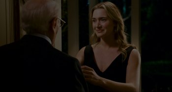 Movie still from “The Holiday” (2006), directed by Nancy Meyers – A man and a woman are talking to each other; Medium shot, Over the shoulder angle