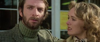 Movie still from “The House by the Cemetery” (1981), directed by Lucio Fulci – A man and a woman talking to each other; Close Up shot, Low angle