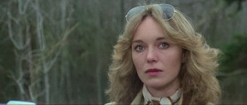 Movie still from “The House by the Cemetery” (1981), directed by Lucio Fulci – A person wearing a jacket and sunglasses; Close Up shot, Low angle