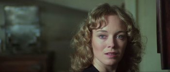 Movie still from “The House by the Cemetery” (1981), directed by Lucio Fulci – A person with curly blonde hair; Close Up shot, Low angle