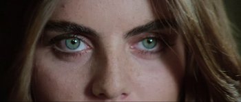 Movie still from “The House by the Cemetery” (1981), directed by Lucio Fulci – A woman's eyes with green eyes; Extreme Close Up shot, Overhead angle