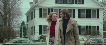 Movie still from “The House by the Cemetery” (1981), directed by Lucio Fulci – A man and a woman walking in front of a house; Medium shot, Low angle