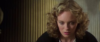 Movie still from “The House by the Cemetery” (1981), directed by Lucio Fulci – A person with curly blonde hair; Close Up shot, High angle