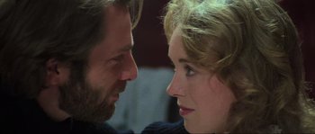 Movie still from “The House by the Cemetery” (1981), directed by Lucio Fulci – A man and a woman looking at each other; Close Up shot, Over the shoulder angle