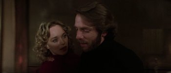 Movie still from “The House by the Cemetery” (1981), directed by Lucio Fulci – A man and a woman looking at one another; Close Up shot, Over the shoulder angle