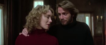 Movie still from “The House by the Cemetery” (1981), directed by Lucio Fulci – A man and a woman standing next to each other; Close Up shot, Over the shoulder angle