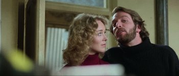Movie still from “The House by the Cemetery” (1981), directed by Lucio Fulci – A man and a woman looking at each other in a room; Close Up shot, Low angle