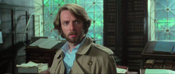 Movie still from “The House by the Cemetery” (1981), directed by Lucio Fulci – A person wearing a jacket; Close Up shot, Low angle