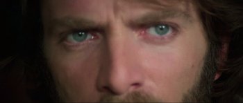 Movie still from “The House by the Cemetery” (1981), directed by Lucio Fulci – A man's eyes and a mustache; Extreme Close Up shot, High angle