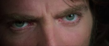 Movie still from “The House by the Cemetery” (1981), directed by Lucio Fulci – A man's eyes with green eyes; Extreme Close Up shot, Low angle