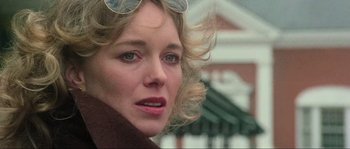 Movie still from “The House by the Cemetery” (1981), directed by Lucio Fulci – A person wearing sunglasses; Close Up shot, Low angle