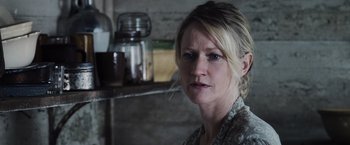 Movie still from “The Hunger Games” (2012), directed by Gary Ross – A person wearing a dress; Close Up shot, Over the shoulder angle