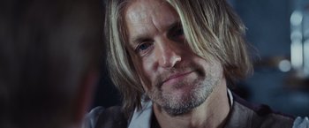 Movie still from “The Hunger Games” (2012), directed by Gary Ross – A person with long hair; Close Up shot, Over the shoulder angle