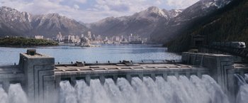 Movie still from “The Hunger Games” (2012), directed by Gary Ross – A view of a lake with a city in the background; Extreme Wide shot, High angle