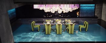 Movie still from “The Hunger Games” (2012), directed by Gary Ross – A dining room with a table and chairs in the center of the room; Wide shot, High angle