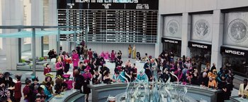 Movie still from “The Hunger Games” (2012), directed by Gary Ross – A crowd of people standing around a building; Extreme Wide shot, High angle