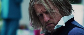 Movie still from “The Hunger Games” (2012), directed by Gary Ross – A person with long hair; Close Up shot, Low angle