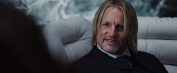 Movie still from “The Hunger Games” (2012), directed by Gary Ross – A person wearing a suit and tie; Close Up shot, Over the shoulder angle