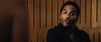 Movie still from “The Hunger Games” (2012), directed by Gary Ross – A person wearing a black shirt; Close Up shot, Over the shoulder angle