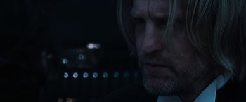 Movie still from “The Hunger Games” (2012), directed by Gary Ross – A person with long hair; Close Up shot, Over the shoulder angle