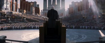 Movie still from “The Hunger Games: Catching Fire” (2013), directed by Francis Lawrence – An image of an old man in the middle of a crowd; Extreme Wide shot, Low angle