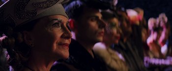 Movie still from “The Hunger Games: Catching Fire” (2013), directed by Francis Lawrence – A group of men and women in costumes; Close Up shot, Over the shoulder angle