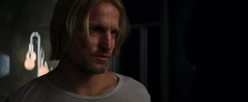 Movie still from “The Hunger Games: Catching Fire” (2013), directed by Francis Lawrence – A person with long blonde hair; Close Up shot, Over the shoulder angle