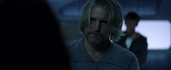 Movie still from “The Hunger Games: Catching Fire” (2013), directed by Francis Lawrence – A person with long blonde hair; Close Up shot, Over the shoulder angle