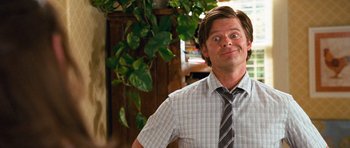 Movie still from “Diary of a Wimpy Kid: Dog Days” (2012), directed by David Bowers – A person wearing a shirt and a tie; Close Up shot, Over the shoulder angle