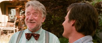 Movie still from “Diary of a Wimpy Kid: Dog Days” (2012), directed by David Bowers – A man in a bow tie is talking to another man in a bow tie; Close Up shot, Over the shoulder angle