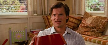 Movie still from “Diary of a Wimpy Kid: Dog Days” (2012), directed by David Bowers – A person holding a cup of coffee; Close Up shot, Low angle