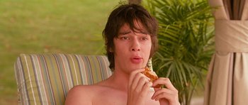 Movie still from “Diary of a Wimpy Kid: Dog Days” (2012), directed by David Bowers – A young man eating a piece of food; Close Up shot, Low angle