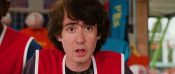 Movie still from “Diary of a Wimpy Kid: Dog Days” (2012), directed by David Bowers – A person wearing a red shirt; Close Up shot, Over the shoulder angle