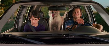 Movie still from “Diary of a Wimpy Kid: Dog Days” (2012), directed by David Bowers – Two people and a dog in the back of a car; Medium shot, Over the shoulder angle