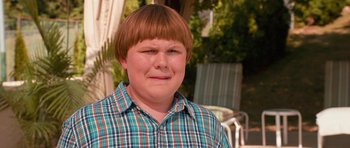 Movie still from “Diary of a Wimpy Kid: Dog Days” (2012), directed by David Bowers – A young boy with a red , white , and blue plaid shirt; Close Up shot, High angle