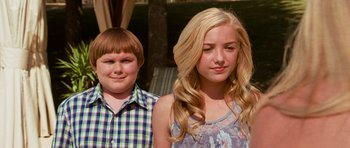 Movie still from “Diary of a Wimpy Kid: Dog Days” (2012), directed by David Bowers – A boy and a girl standing next to each other; Medium shot, Over the shoulder angle