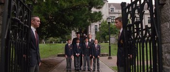 Movie still from “Diary of a Wimpy Kid: Dog Days” (2012), directed by David Bowers – A group of young men standing next to each other on a sidewalk; Wide shot, Low angle