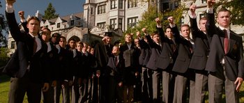 Movie still from “Diary of a Wimpy Kid: Dog Days” (2012), directed by David Bowers – A group of young people in suits and ties; Wide shot, Low angle