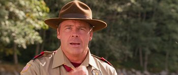 Movie still from “Diary of a Wimpy Kid: Dog Days” (2012), directed by David Bowers – A person wearing a uniform and a hat; Close Up shot, Low angle