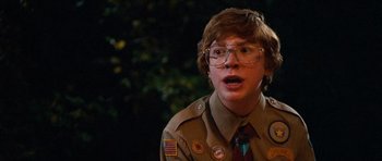 Movie still from “Diary of a Wimpy Kid: Dog Days” (2012), directed by David Bowers – A young man wearing a uniform and a tie; Medium shot, Over the shoulder angle