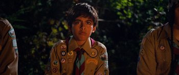 Movie still from “Diary of a Wimpy Kid: Dog Days” (2012), directed by David Bowers – A young boy wearing a uniform with a lot of badges on his shirt; Close Up shot, Over the shoulder angle
