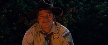 Movie still from “Diary of a Wimpy Kid: Dog Days” (2012), directed by David Bowers – A man wearing a hat and a scout uniform; Close Up shot, Over the shoulder angle