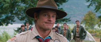 Movie still from “Diary of a Wimpy Kid: Dog Days” (2012), directed by David Bowers – A man wearing a hat and a brown hat; Close Up shot, Over the shoulder angle