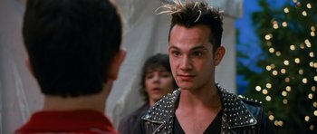 Movie still from “Diary of a Wimpy Kid: Dog Days” (2012), directed by David Bowers – A young man with spiky black hair and a black jacket; Close Up shot, Over the shoulder angle