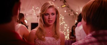 Movie still from “Diary of a Wimpy Kid: Dog Days” (2012), directed by David Bowers – A beautiful blonde woman in a white dress; Close Up shot, Over the shoulder angle