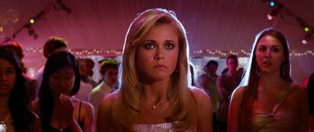 Movie still from “Diary of a Wimpy Kid: Dog Days” (2012), directed by David Bowers – A beautiful young blonde woman in a white dress; Close Up shot, Low angle