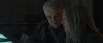 Movie still from “The Hunger Games: Mockingjay - Part 1” (2014), directed by Francis Lawrence – A man and a woman looking at something on a computer screen; Close Up shot, Over the shoulder angle