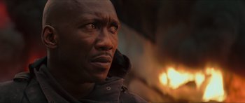 Movie still from “The Hunger Games: Mockingjay - Part 1” (2014), directed by Francis Lawrence – A person wearing a hooded jacket; Close Up shot, Low angle